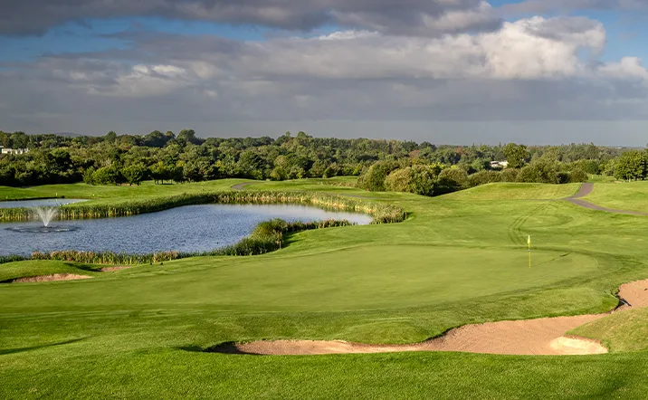 Lawn, bunker and water feature on golf course