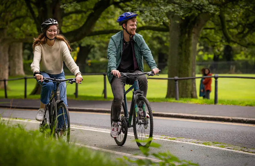 Couple Cycling in park